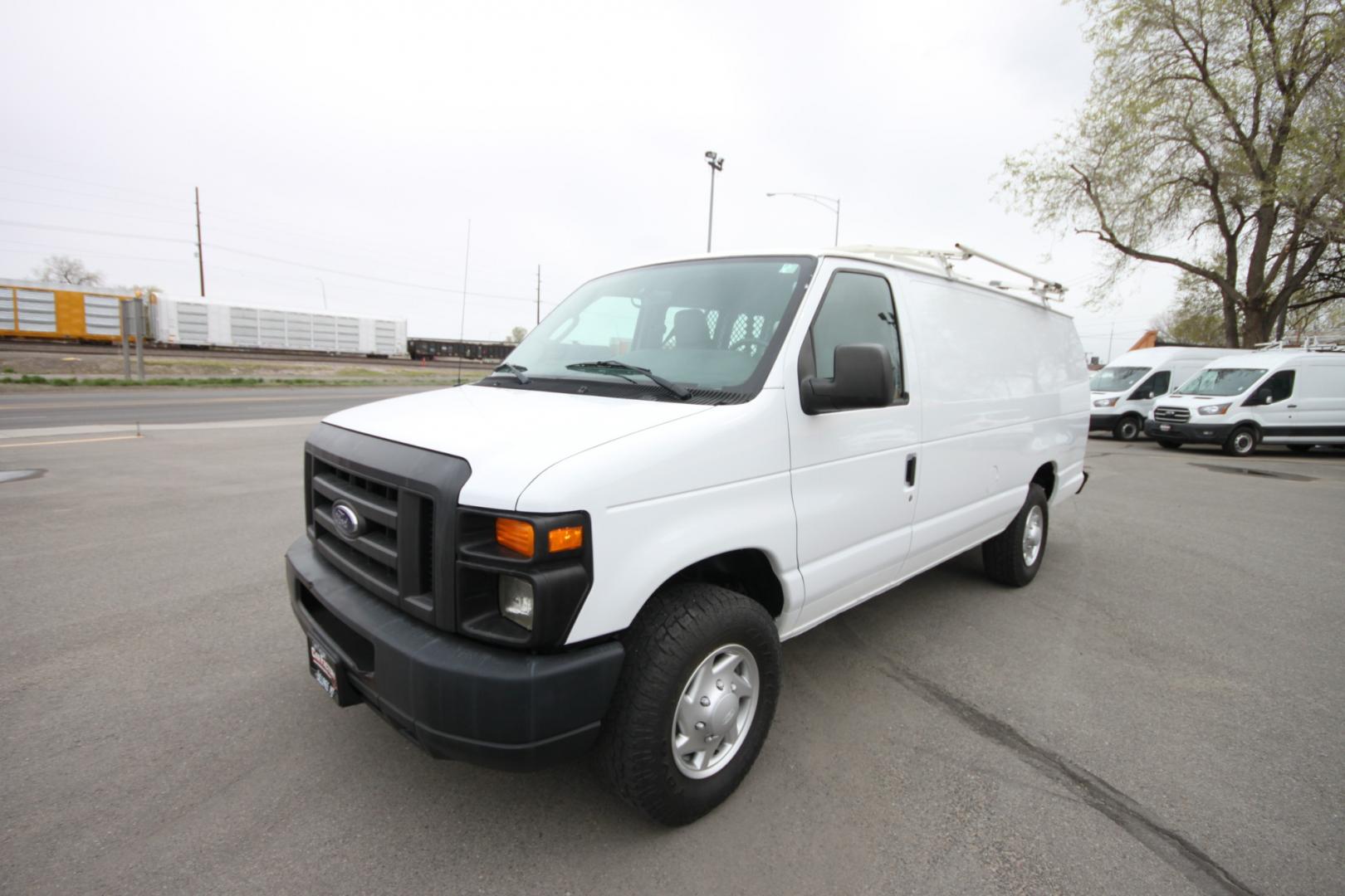 2014 White /Grey Ford E-Series Van (1FTSS3EL3ED) with an 5.4L V8 engine, Automatic transmission, located at 4562 State Avenue, Billings, MT, 59101, (406) 896-9833, 45.769516, -108.526772 - 2014 Ford E-350 Super Duty Extended Cargo Van - One owner - 62,000 miles! 5.4L V8 SOHC 16V FFV Engine - 4 speed automatic transmission - rear wheel drive - 62,752 miles - One owner - Inspected and serviced - Ready to go to work today! Air conditioning - tilt steering wheel - AM/FM audio - powe - Photo#1